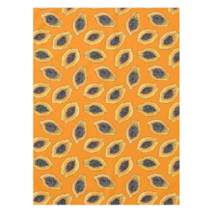 Papaya slices on orange tablecloth