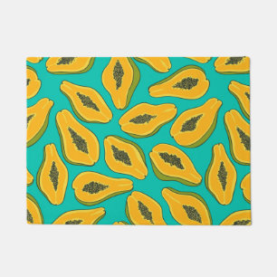 Papaya slices on turquoise doormat