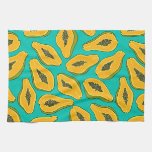 Papaya slices on turquoise tea towel