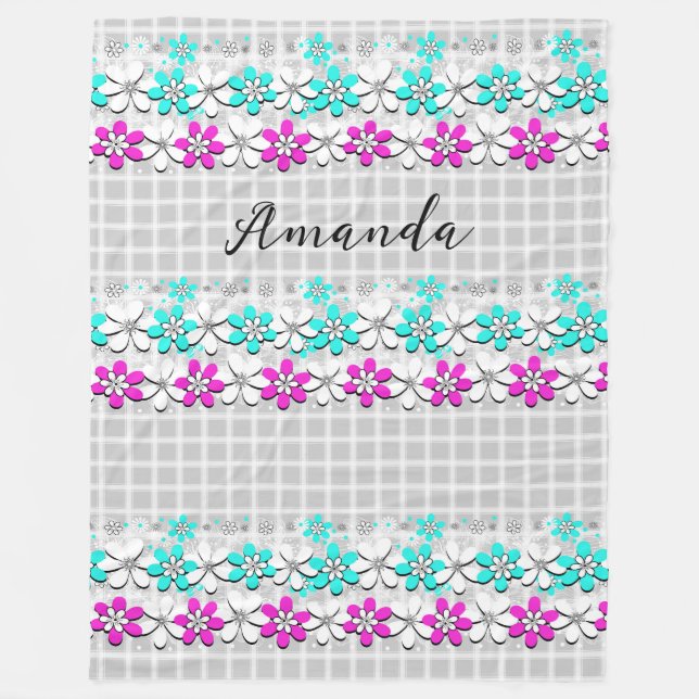 Paper neon flowers on a grey-white chequered  fleece blanket (Front)