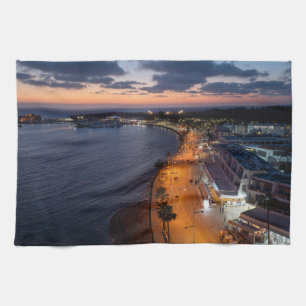 Paphos seafront and harbour at night tea towel