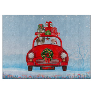 Papillon Dog In Car With Santa Claus Cutting Board