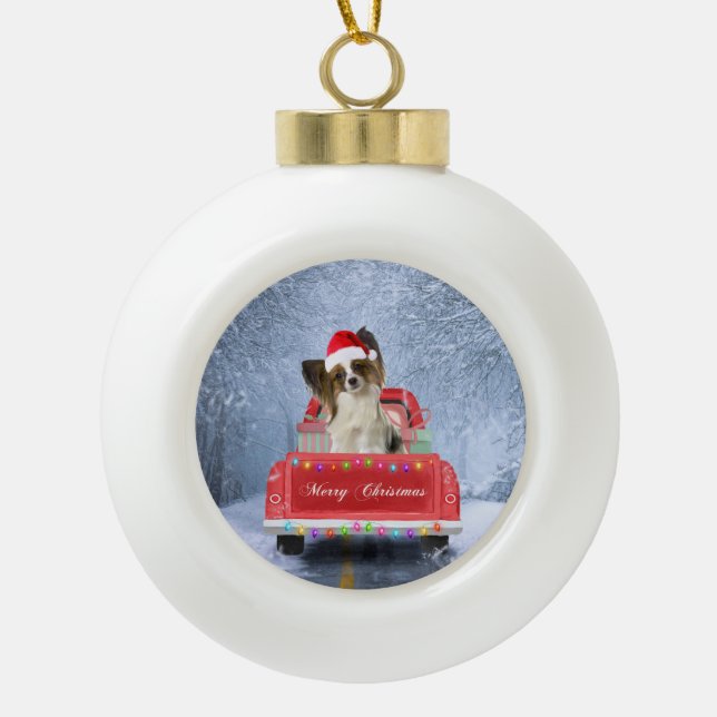 Papillon Dog in Snow sitting in Christmas Truck  Ceramic Ball Christmas Ornament (Front)