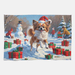 Papillon Dog Running in Snow with Christmas Hat Tea Towel