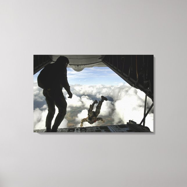 Pararescuemen jump out the back of a C-130 Canvas Print (Front)