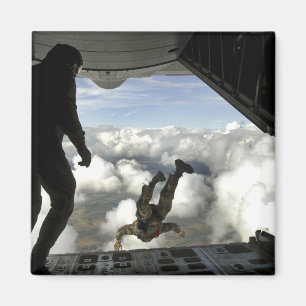 Pararescuemen jump out the back of a C-130 Magnet