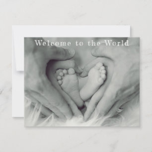 Parent Hands and Baby Feet Welcome to the World Announcement