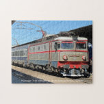Passenger Train at Bucharest Railway Station on a Jigsaw Puzzle<br><div class="desc">Passenger Train at Bucharest North Railway Station, in Romania. Photograph of a locomotive and carriages standing in the station.</div>