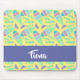 Pastel colourful fishes on yellow mouse mat
