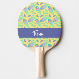 Pastel colourful fishes on yellow ping pong paddle