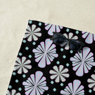 Pastel floral shapes on a black background beach towel
