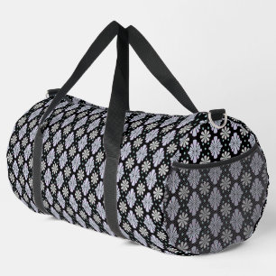 Pastel floral shapes on a black background duffle bag