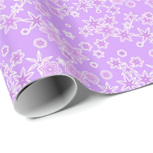 Pastel snowflakes against orchid wrapping paper