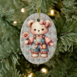 Pastel Teddy Bear Holding Flower Wearing Overalls Ceramic Tree Decoration<br><div class="desc">This sweet pastel teddy bear design captures a heartwarming, storybook charm with its soft, textured brushwork and cosy vintage aesthetic. Dressed in distressed denim overalls adorned with a pink bow and gingham patchwork, the bear holds a delicate daisy-like flower, radiating innocence and gentle warmth. Large, glossy eyes and blushing cheeks...</div>