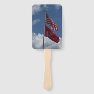 Patriotic flags and a blue sky on a hand fan