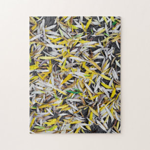 Pattern of the falling leaves on black jigsaw puzzle