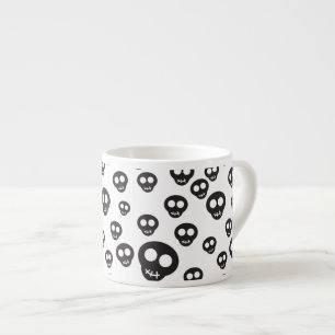 Pattern with black skulls on white espresso cup