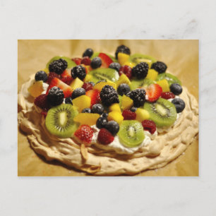 Pavlova garnished with colourful fruits postcard