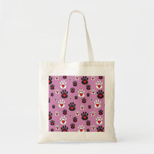 Paw prints with red hearts on pink tote bag