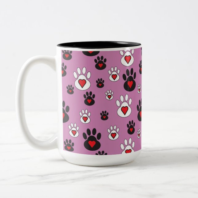 Paw prints with red hearts on pink  Two-Tone coffee mug (Left)