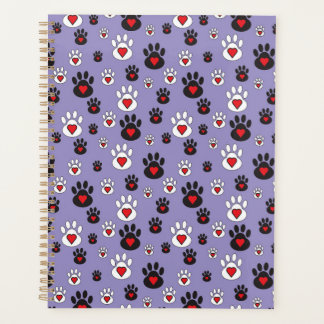 Pawprints with red hearts on blue planner