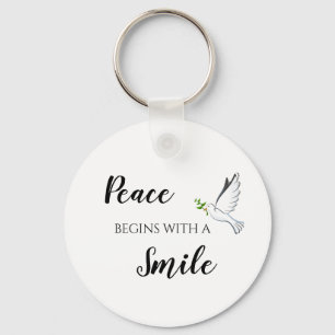 Peace begins with a smile dove quote key ring