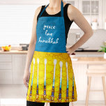 Peace Love Hanukkah Script Yellow Menorah Custom Apron<br><div class="desc">“Peace, love, Hanukkah.” Here’s a wonderful way add to the fun of your holiday baking. Add extra sparkle to your holiday culinary adventures whenever you wear this stunning, colourful, Hanukkah apron. A close-up photo of a bright, colourful, yellow gold artsy menorah photo, along with calligraphy script overlaying a textured turquoise,...</div>