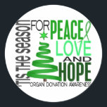 Peace Love Hope Christmas Holiday Organ Donation Classic Round Sticker<br><div class="desc">Tis the Season for Peace, Love, Hope, and Organ Donation Awareness. What better time to share the important message of organ donation awareness than during the beautiful holiday season of peace, love, and hope. Our whimsical ribbon Christmas tree, eye-catching layout, and green organ donation awareness ribbon all come together to...</div>