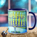 “Peace, Love & Light” Blue Hanukkah Menorah Photo Mug<br><div class="desc">“Peace, love & light.” A close-up photo of a bright, colourful, blue and green artsy menorah helps you usher in the holiday of Hanukkah in style. Feel the warmth and joy of the holiday season whenever you drink out of this stunning, colourful Hanukkah coffee mug. Makes a striking set of...</div>