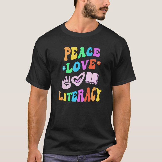 PEACE LOVE LITERACY Retro Reading Teacher Groovy B T-Shirt (Front)