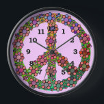 Peace Sign Symbol Flower Pretty Clock<br><div class="desc">This pretty, colourful clock features a retro peace sign / peace symbol with tie dye colours and brightly coloured flowers over it. It's a colourful floral design for proud hippies / lovers of world peace. The clock numbers are black and the background colour is light pink, but you can "customise...</div>