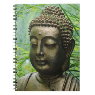 Peaceful Buddha Statue in a Leafy Green Forest Notebook