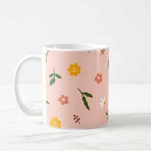 Peach background with multiple color flowers coffee mug
