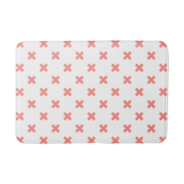 Peach cross stitches on white bath mat (Front)