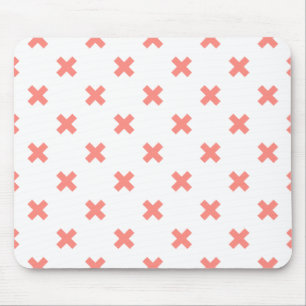Peach cross stitches on white mouse mat