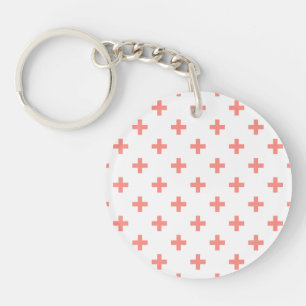 Peach polka crosses on white key ring