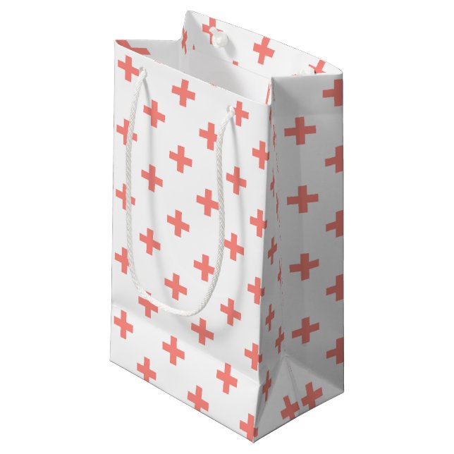 Peach polka crosses on white small gift bag (Front Angled)