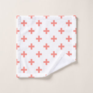 Peach polka crosses on white wash cloth