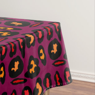 peach red in black border patterns on wine colour tablecloth