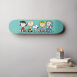 Peanuts Gang Sitting Together Skateboard<br><div class="desc">Check out Lucy,  Charlie Brown,  Snoopy,  Sally,  and Linus sitting together in a row.</div>