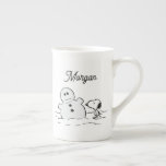Peanuts | Snoopy Builds A Snowman | Add Your Name Bone China Mug<br><div class="desc">Check out this fun Peanuts design featuring Snoopy.</div>