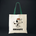 Peanuts | Snoopy Golf Swing Tote Bag<br><div class="desc">Snoopy,  the beloved beagle from the Peanuts comic strip,  is depicted in this design swinging a golf club.</div>