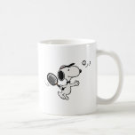 Peanuts | Snoopy Plays Tennis Coffee Mug<br><div class="desc">In the Peanuts comic strip and animated films,  Snoopy is often depicted playing tennis against his owner Charlie Brown or other characters like Linus and Lucy. This design showcases Snoopy's athletic abilities and competitive spirit in a humourous way.</div>