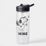 Peanuts | Snoopy Plays Tennis Water Bottle<br><div class="desc">In the Peanuts comic strip and animated films,  Snoopy is often depicted playing tennis against his owner Charlie Brown or other characters like Linus and Lucy. This design showcases Snoopy's athletic abilities and competitive spirit in a humourous way.</div>