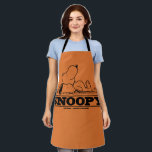 Peanuts | Snoopy Rest Break Apron<br><div class="desc">Snoopy,  the beloved beagle from the Peanuts comic strip,  is often depicted resting or sleeping with a contented smile on his face. Although he's using a rock as his pillow,  this image captures his laid-back and cheerful personality.</div>