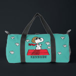 Peanuts | Snoopy the Flying Ace Duffle Bag<br><div class="desc">This cute Peanuts design features Snoopy as the World War I flying ace reading to take on the Red Baron of Germany.</div>