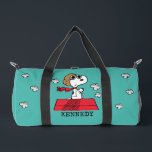 Peanuts | Snoopy the Flying Ace Duffle Bag<br><div class="desc">This cute Peanuts design features Snoopy as the World War I flying ace reading to take on the Red Baron of Germany.</div>