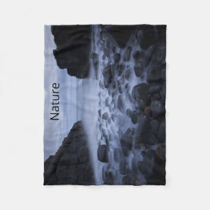 Pebbles and Rocks along the Ocean Shoreline Fleece Blanket