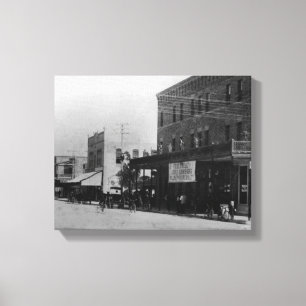 Pedestrians, cyclists, and horse-carriages canvas print