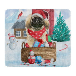 Pekingese Dog In snow Christmas Dog House Cutting Board